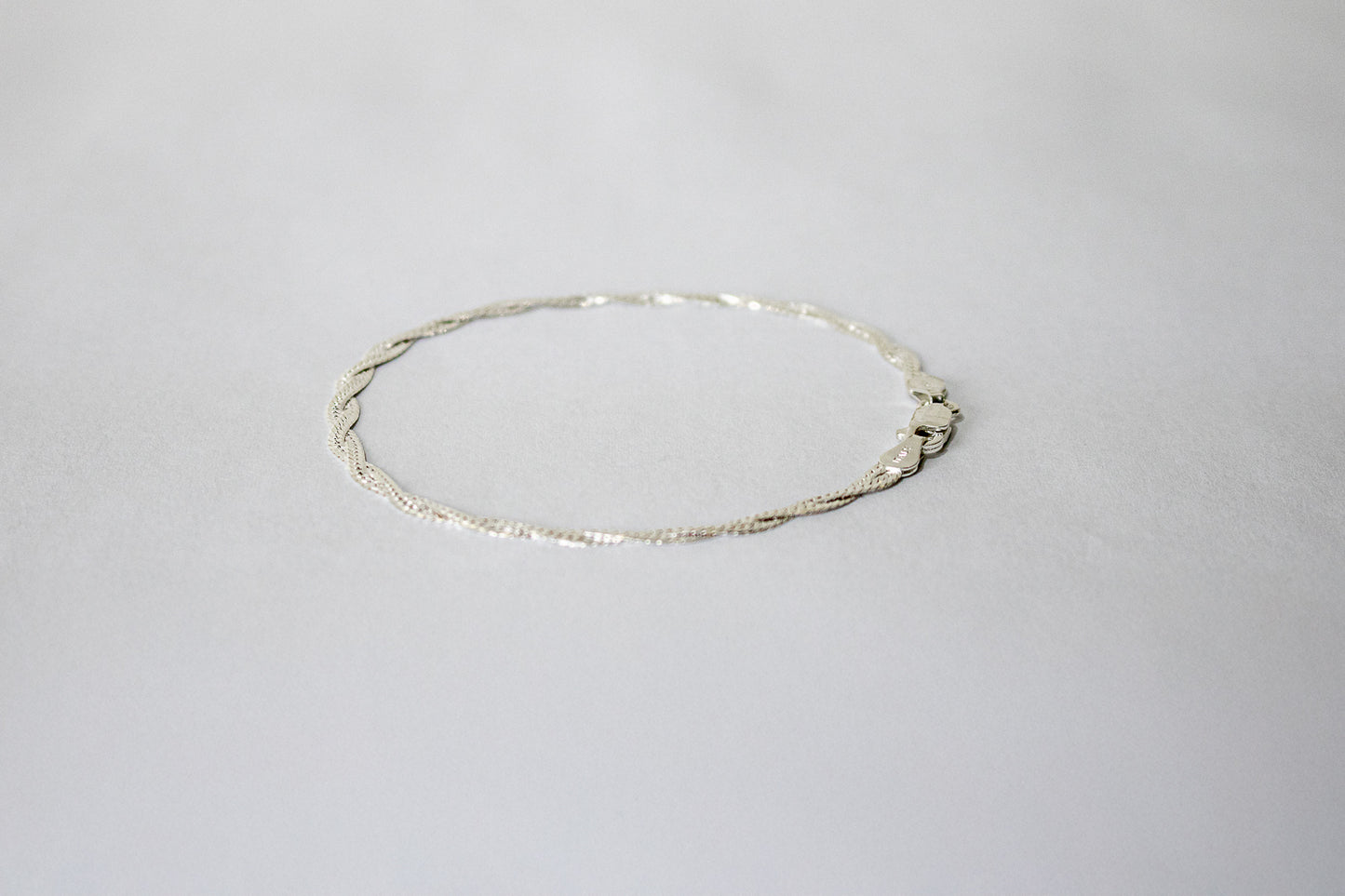 PULSEIRA TRANÇADA LAMINADA EM PRATA 925