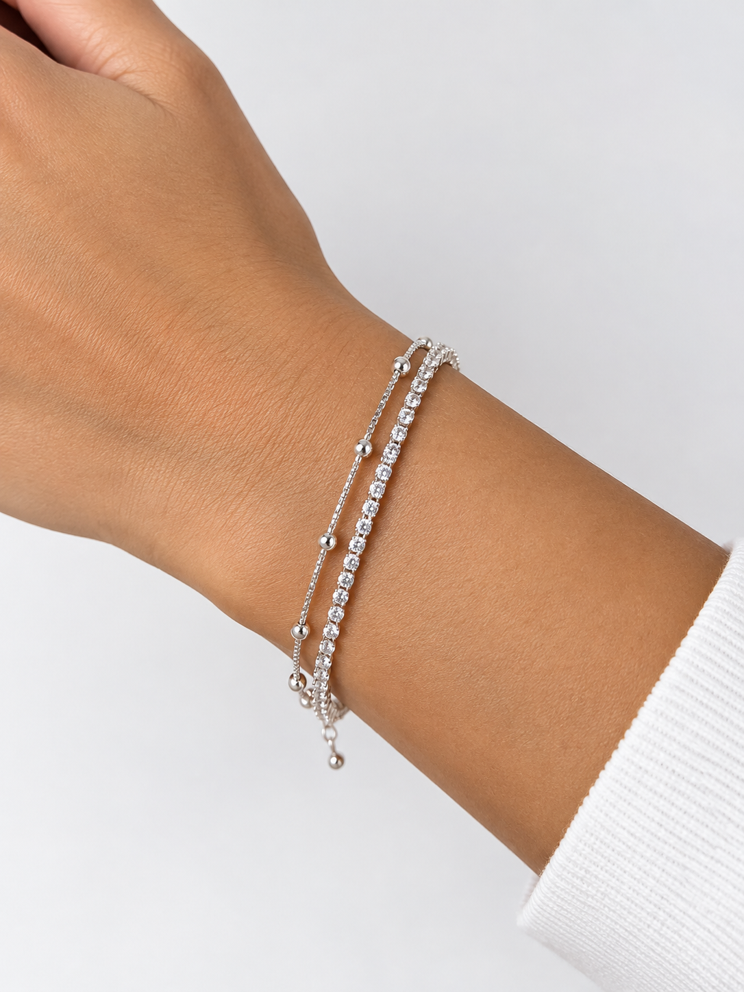 PULSEIRA DUPLA RIVIEIRA CRISTAL E BOLINHAS SEMIJOIA PRATEADA